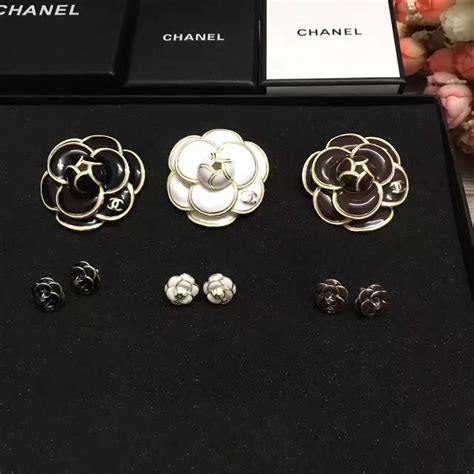 sautoirs chanel|Chanel camellia flower brooch.